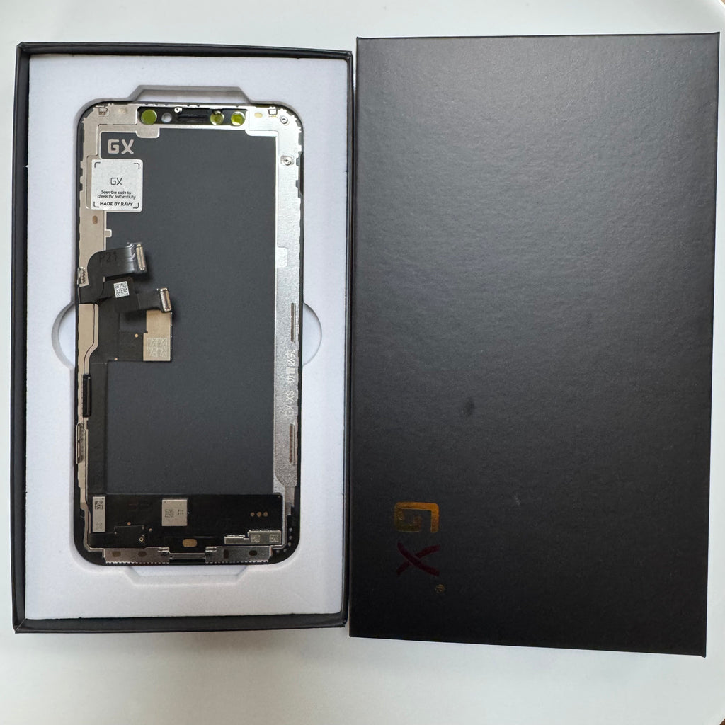 Hard OLED screen for iPhone XS in its tray, beside its box lid